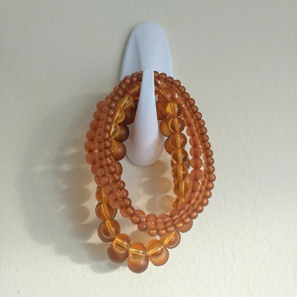 Amber Tone Set of Bracelets Varying Sizes Brown